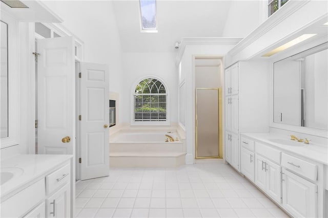 bathroom featuring tile patterned floors, high vaulted ceiling, separate shower and tub, and vanity