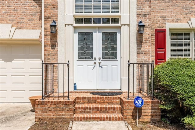 property entrance with a garage