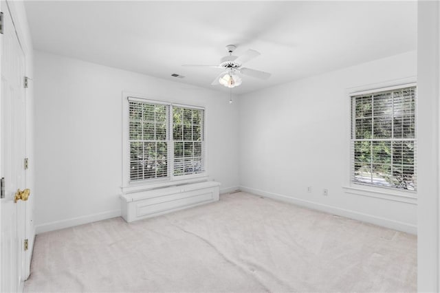 carpeted empty room with ceiling fan