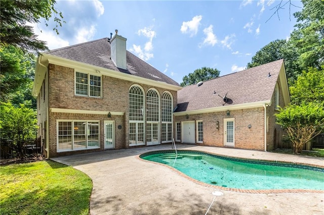 back of house with a patio