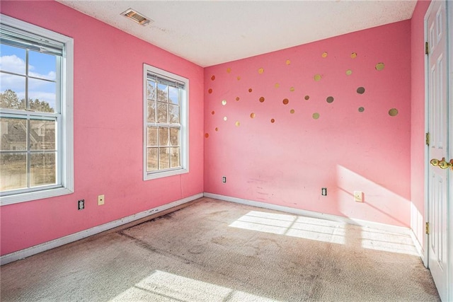 spare room featuring carpet floors