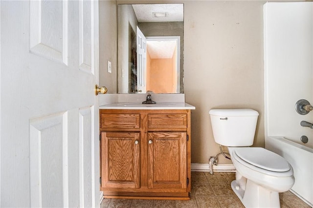 full bathroom featuring vanity, tub / shower combination, and toilet