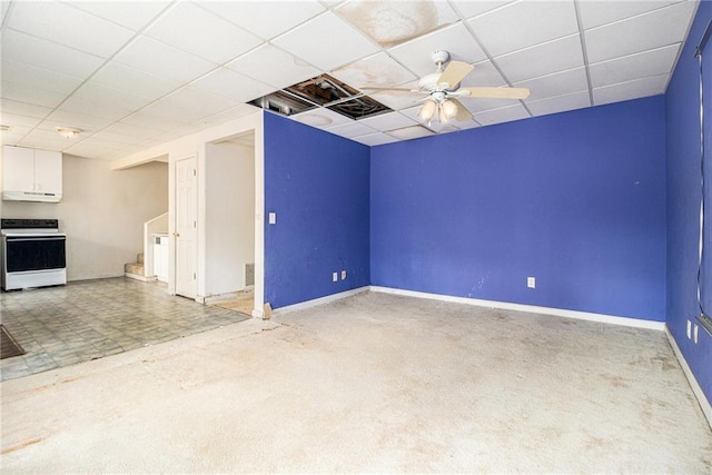 unfurnished living room with carpet, a paneled ceiling, and ceiling fan