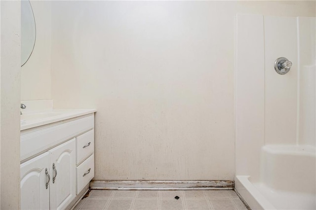 bathroom with a shower and vanity