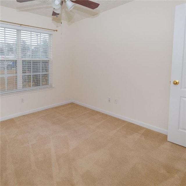 carpeted empty room with ceiling fan