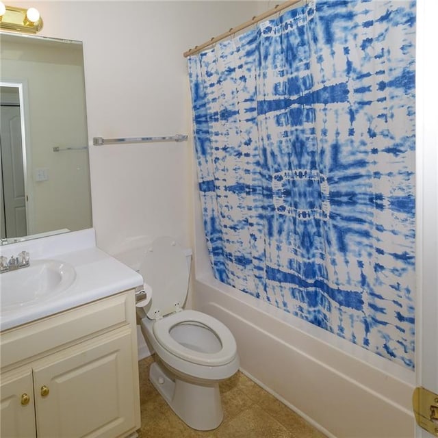 full bathroom with vanity, shower / bath combo, and toilet