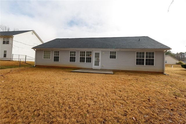 back of house featuring a yard and a patio area