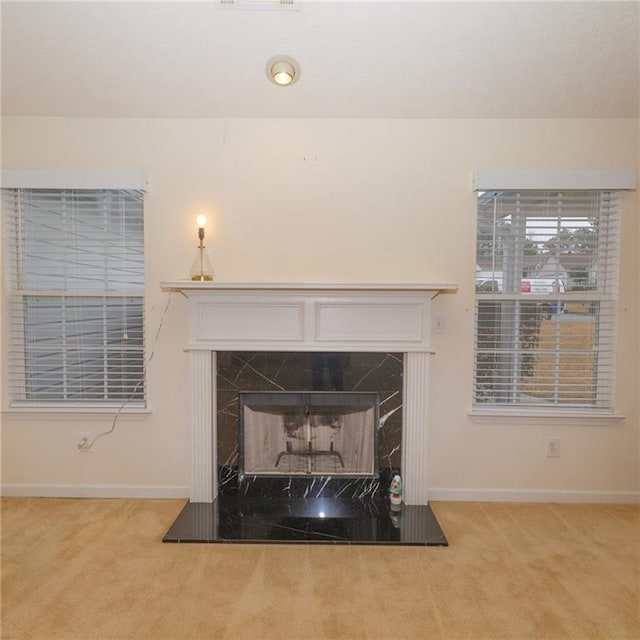 interior details featuring carpet flooring and a fireplace