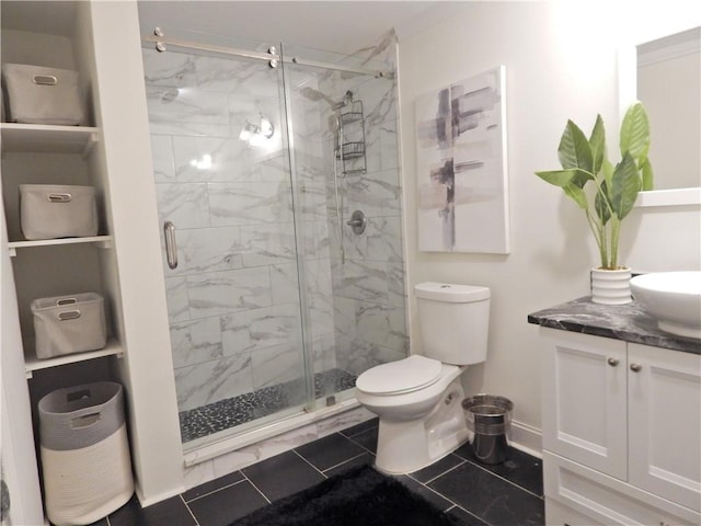 full bath featuring toilet, a stall shower, baseboards, and vanity