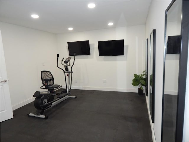 exercise area featuring recessed lighting and baseboards