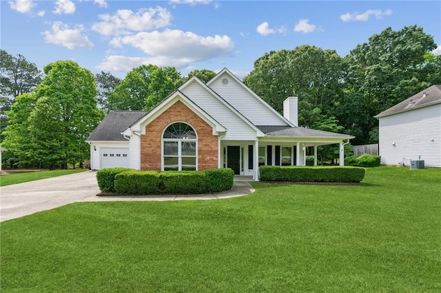 view of front of home featuring a front lawn, brick siding, a garage, a chimney, and concrete driveway