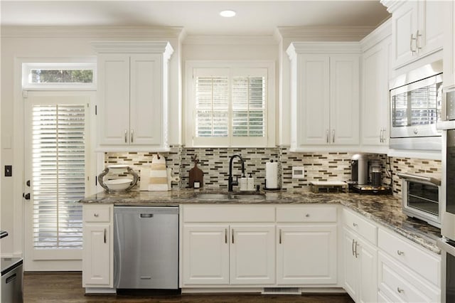 kitchen with white cabinets, dark stone countertops, sink, and appliances with stainless steel finishes