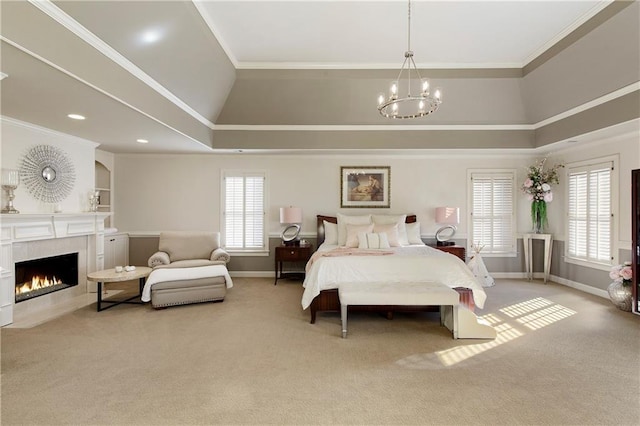 bedroom with an inviting chandelier, light colored carpet, ornamental molding, and a tiled fireplace