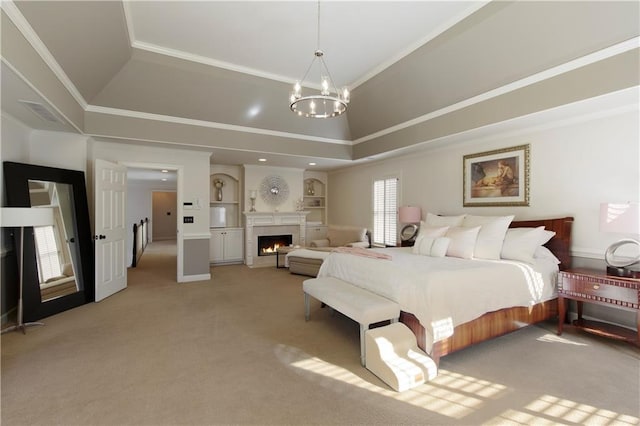 carpeted bedroom with vaulted ceiling, a raised ceiling, ornamental molding, and an inviting chandelier