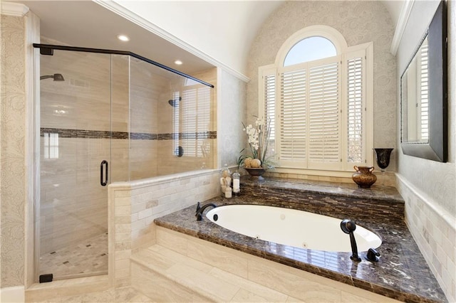 bathroom featuring lofted ceiling and independent shower and bath