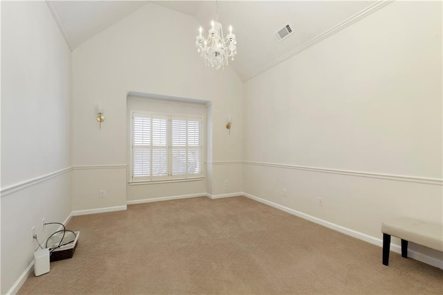 empty room featuring light carpet, high vaulted ceiling, crown molding, and a notable chandelier