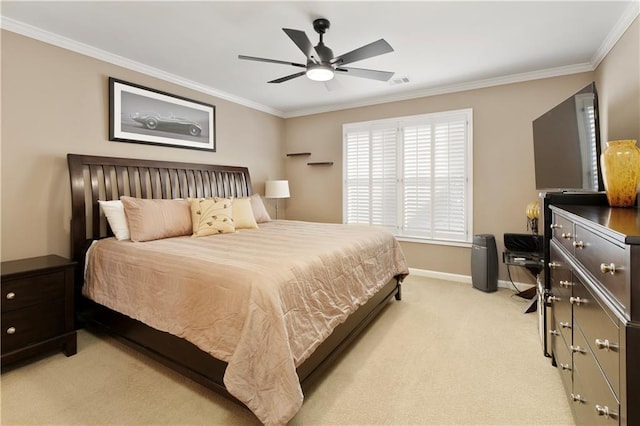 carpeted bedroom featuring ceiling fan and ornamental molding