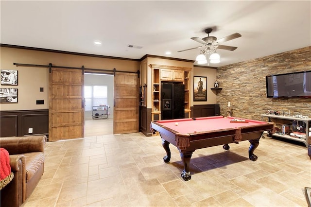 rec room featuring a barn door, ceiling fan, crown molding, and pool table