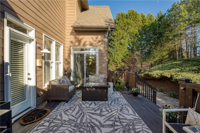 wooden terrace with outdoor lounge area