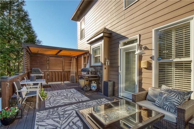 wooden terrace with a grill