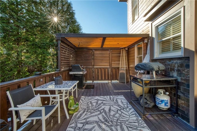 wooden terrace featuring grilling area