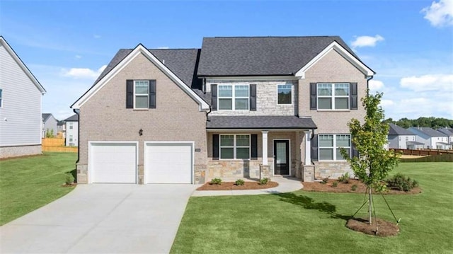 310 Aspen Valley Dr, Loganville, GA 30052 - view of front of home featuring a garage, a front lawn, and covered porch