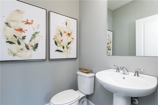 bathroom featuring sink and toilet