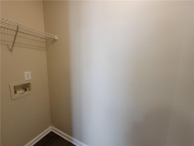 laundry area featuring hookup for a washing machine and hardwood / wood-style floors