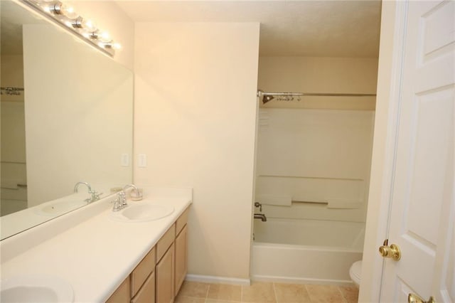 988 Vintage Pointe Dr, Lawrenceville, GA 30044 - bathroom featuring a sink, toilet, double vanity, and bathtub / shower combination