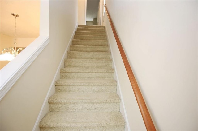 988 Vintage Pointe Dr, Lawrenceville, GA 30044 - staircase with a notable chandelier