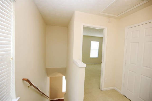988 Vintage Pointe Dr, Lawrenceville, GA 30044 - corridor with baseboards, an upstairs landing, light carpet, and a textured ceiling