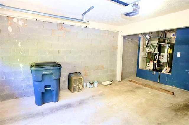 988 Vintage Pointe Dr, Lawrenceville, GA 30044 - garage with a garage door opener, gas water heater, and concrete block wall