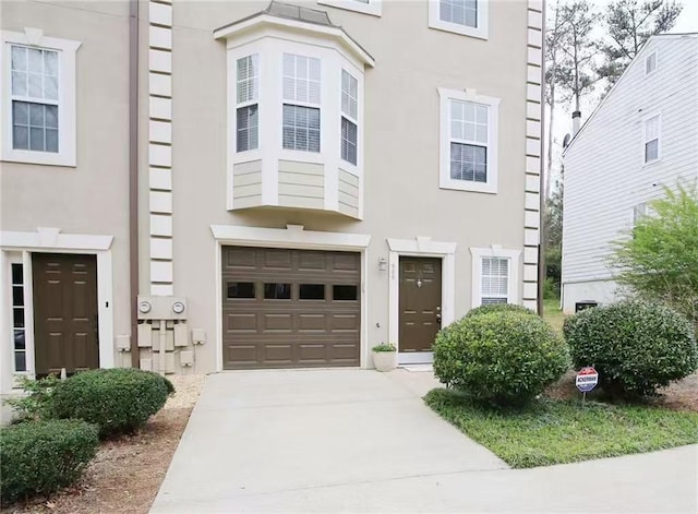 988 Vintage Pointe Dr, Lawrenceville, GA 30044 - multi unit property with concrete driveway, a garage, and stucco siding