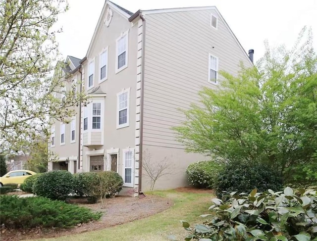 988 Vintage Pointe Dr, Lawrenceville, GA 30044 - view of property exterior with stucco siding