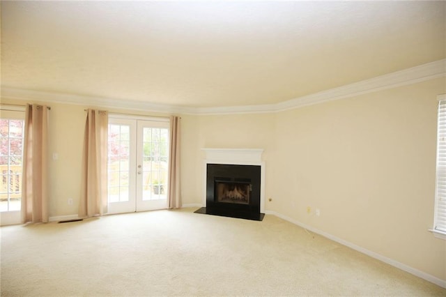 988 Vintage Pointe Dr, Lawrenceville, GA 30044 - unfurnished living room with crown molding, french doors, a wealth of natural light, and carpet flooring