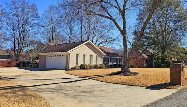 ranch-style home featuring a garage