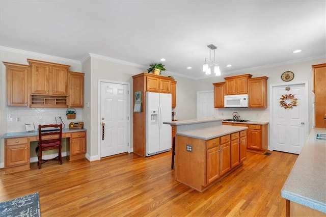 kitchen featuring decorative backsplash, a kitchen island, white appliances, recessed lighting, and light wood-type flooring