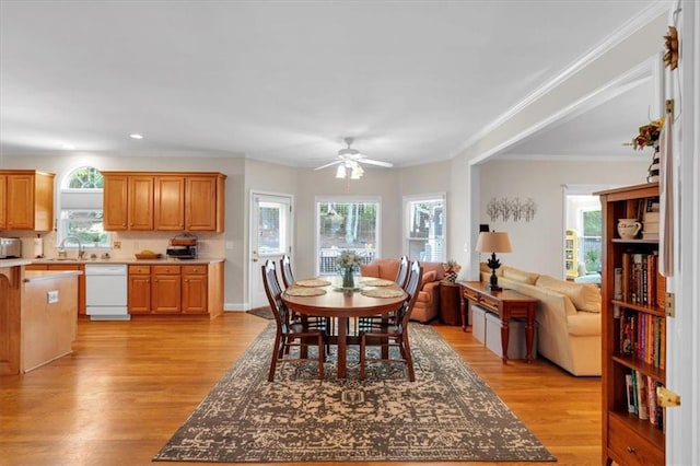 dining room with crown molding, recessed lighting, ceiling fan, and light wood finished floors