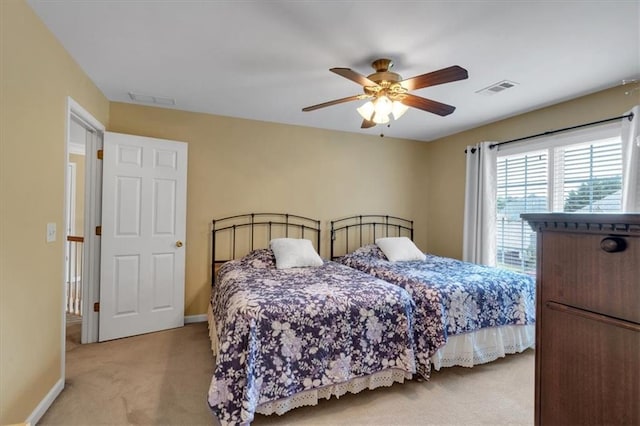 bedroom with visible vents, carpet flooring, and baseboards