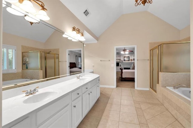 ensuite bathroom featuring a sink, vaulted ceiling, ensuite bath, and visible vents