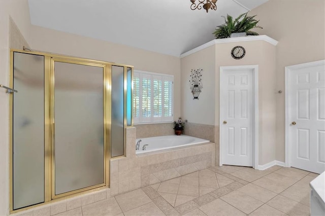 bathroom with tile patterned floors, a garden tub, a stall shower, and high vaulted ceiling