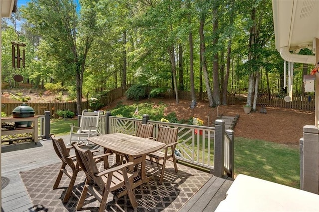 deck featuring fence and outdoor dining space