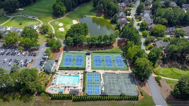 aerial view with a water view and view of golf course