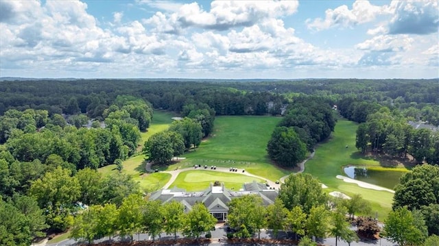 birds eye view of property featuring a water view, golf course view, and a wooded view