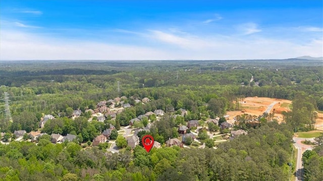 drone / aerial view featuring a view of trees
