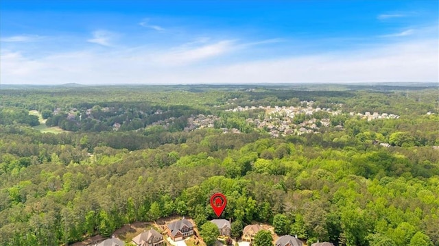 birds eye view of property with a forest view