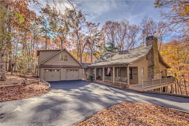 view of front of home with a porch and a garage