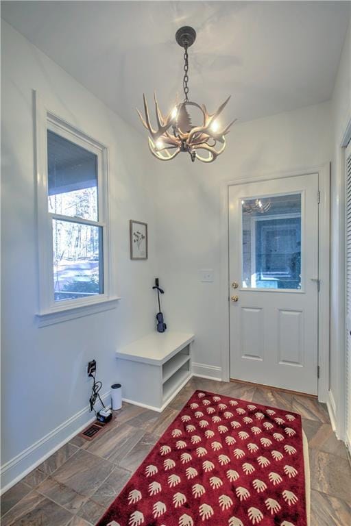 208 Trout Lily Trl, Big Canoe, GA 30143 - entrance foyer with a chandelier and baseboards