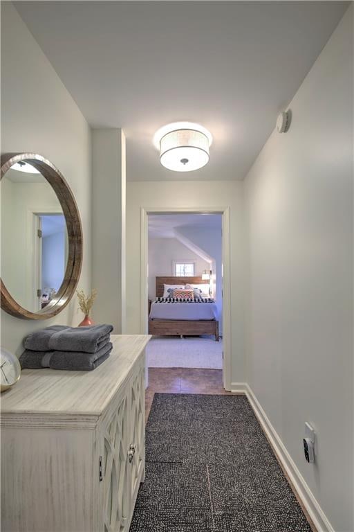 hall with light tile patterned floors