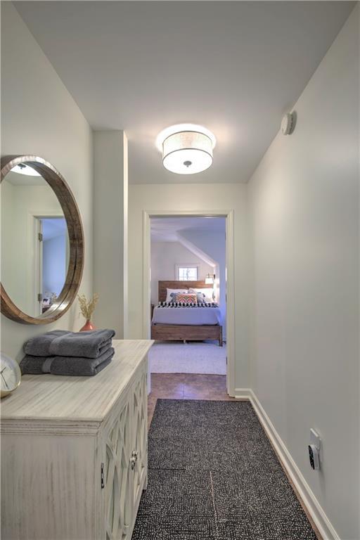 208 Trout Lily Trl, Big Canoe, GA 30143 - hallway with baseboards and dark tile patterned floors